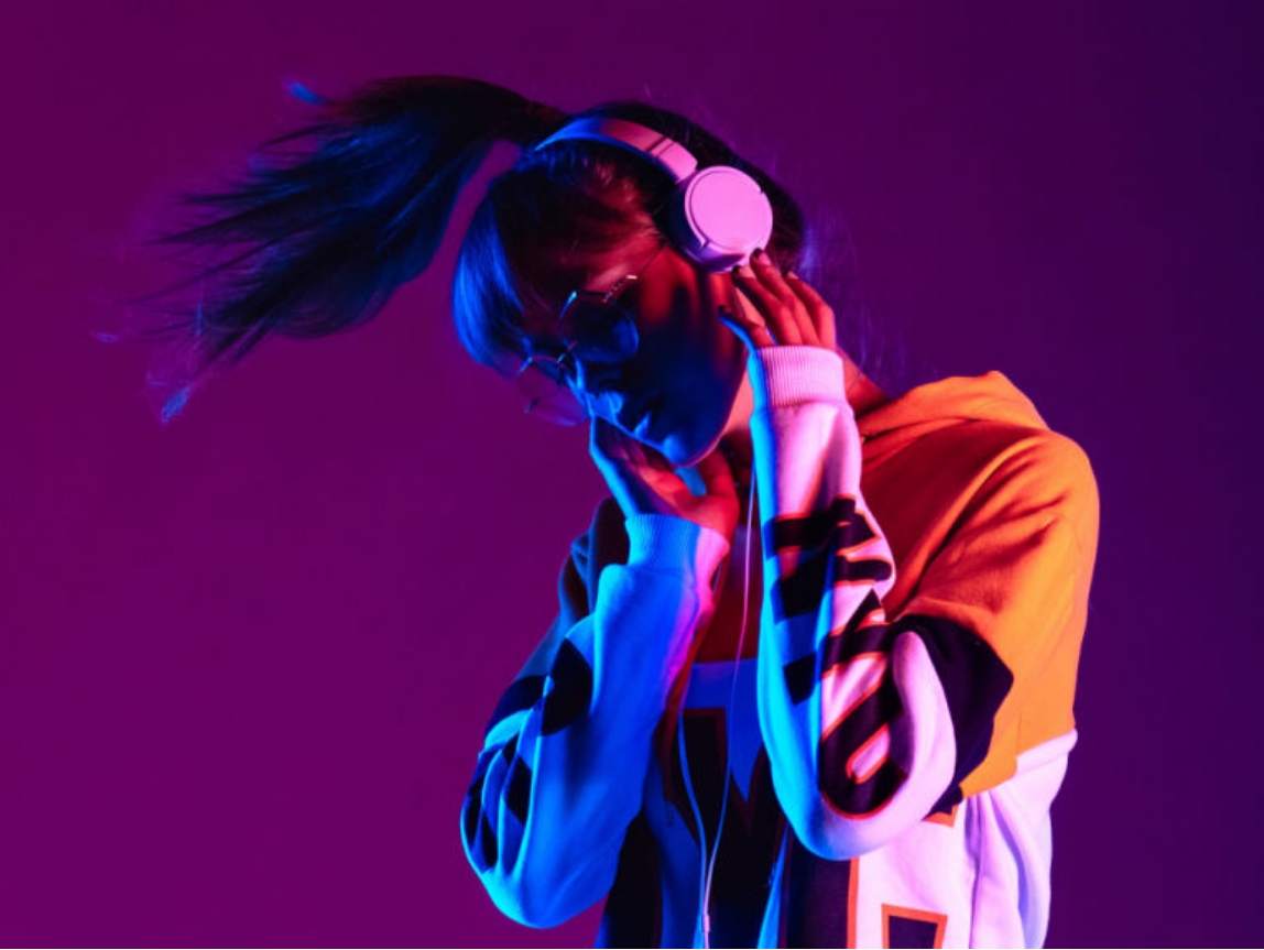 women listening to headphones while dancing